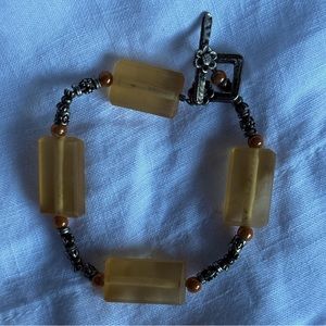 Chunky beaded amber bracelet with flower clasp closure